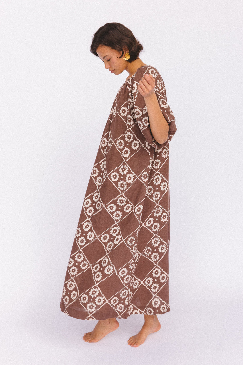 Dahlia Maxi Dress Maple — studio side profile showing full length silhouette, hand block print linen with flowing tiered skirt, Jaipur-made artisan dress | Daughters of India