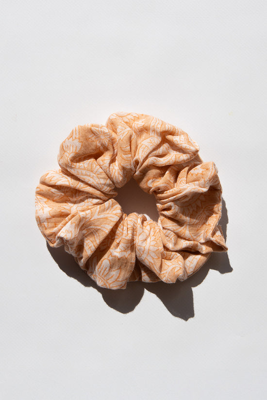 Daughters of India Upcycled Scrunchie in Apricot Blush, a soft peach-orange hair scrunchie made from upcycled cotton fabric