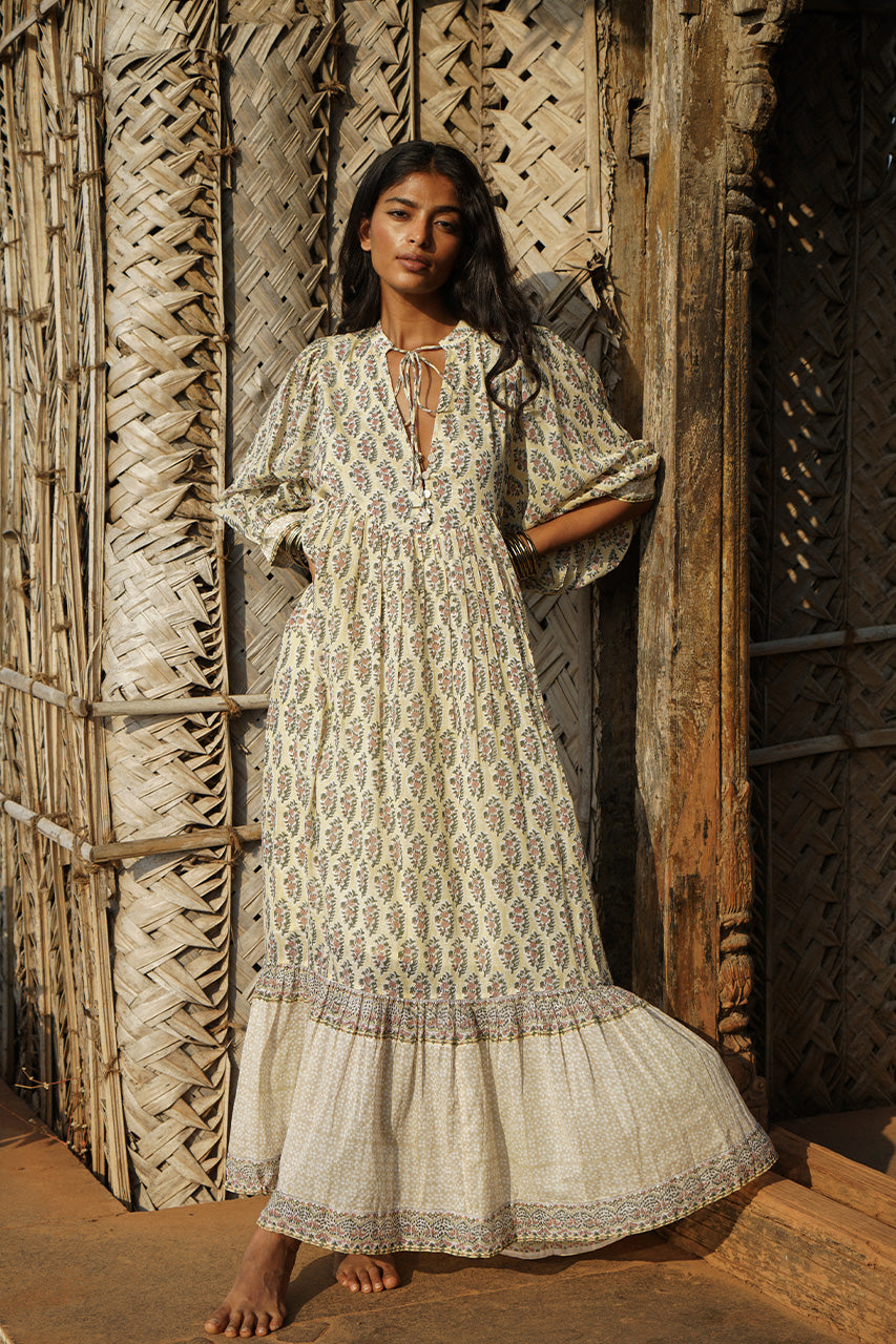 Bhoomi Maxi Dress Meadow — full length against rustic wood, tiered hem detail, hand block print cotton | Daughters of India