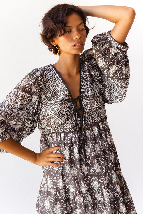 Daughters of India Jasmine Midi Dress in Charcoal — studio close-up V-neckline tie and balloon sleeve detail