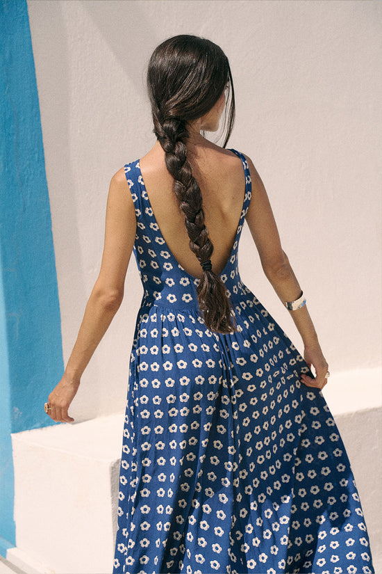 Veda Dress Indigo — side profile view, model wearing indigo hand block print linen blend midi dress showing silhouette and drape, white background, artisan Jaipur India | Daughters of India
